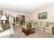 Living room with two sofas, coffee table, and backyard access at 280 Windmeadows St, Altamonte Springs, FL 32701