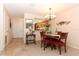 Bright dining area with a wood table and chairs, view of kitchen at 280 Windmeadows St, Altamonte Springs, FL 32701