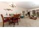 Living room with dining table, sofa, and access to backyard at 280 Windmeadows St, Altamonte Springs, FL 32701