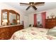 Bedroom with floral bedding, dresser, and ceiling fan at 280 Windmeadows St, Altamonte Springs, FL 32701