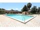 Inviting community pool with patio furniture and lush landscaping at 280 Windmeadows St, Altamonte Springs, FL 32701
