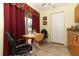 Small kitchenette with wood cabinets and a round table for two at 280 Windmeadows St, Altamonte Springs, FL 32701