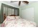 Bright bedroom with floral bedding and built-in closet at 280 Windmeadows St, Altamonte Springs, FL 32701