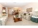 Living room with a sofa and coffee table, open to dining area at 280 Windmeadows St, Altamonte Springs, FL 32701