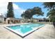 Community pool with patio furniture and lush landscaping at 280 Windmeadows St, Altamonte Springs, FL 32701