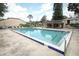Community pool with patio furniture and nearby building at 280 Windmeadows St, Altamonte Springs, FL 32701