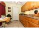 Kitchen with wood cabinets and breakfast nook at 280 Windmeadows St, Altamonte Springs, FL 32701