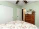 Bedroom with floral bedding, wooden dresser, and closet at 280 Windmeadows St, Altamonte Springs, FL 32701