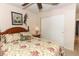 Bedroom with floral bedding, wooden dresser, and ample closet space at 280 Windmeadows St, Altamonte Springs, FL 32701