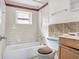 Bathroom with a bathtub, shower, and tiled walls at 447-441 N Lincoln St, Daytona Beach, FL 32114