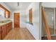 View of kitchen with wood cabinets, flooring, and pass-through window at 447-441 N Lincoln St, Daytona Beach, FL 32114