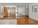 Living room with hardwood floors and mirrored wall at 447-441 N Lincoln St, Daytona Beach, FL 32114