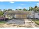 Two-car carport with a metal roof and concrete parking area at 447-441 N Lincoln St, Daytona Beach, FL 32114