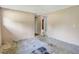 Empty bedroom with damaged flooring and access to other rooms at 447-441 N Lincoln St, Daytona Beach, FL 32114