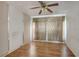 Simple bedroom with hardwood floors and window coverings at 447-441 N Lincoln St, Daytona Beach, FL 32114