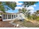 House exterior showcasing a screened porch and yard at 504 Osceola Ave, Eustis, FL 32726