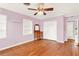 Charming bedroom with hardwood floors and built-in shelving at 504 Osceola Ave, Eustis, FL 32726