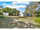 House exterior showcasing a light gray color and a shed at 504 Osceola Ave, Eustis, FL 32726