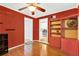 Home office with hardwood floors and red painted walls at 504 Osceola Ave, Eustis, FL 32726