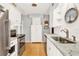 Bright kitchen with stainless steel appliances and granite countertops at 504 Osceola Ave, Eustis, FL 32726