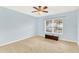 Light and airy bedroom with neutral walls and carpeting at 504 Osceola Ave, Eustis, FL 32726