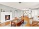 Open living space with hardwood floors, fireplace, and built-in shelving at 504 Osceola Ave, Eustis, FL 32726
