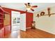 Bright office featuring built-in shelves and hardwood floors at 504 Osceola Ave, Eustis, FL 32726
