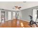 Bright bedroom featuring hardwood floors and a ceiling fan at 504 Osceola Ave, Eustis, FL 32726