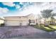 Two-story home with a three-car garage and a large driveway at 1511 Alligator St, St Cloud, FL 34771