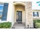Elegant front door entry with stone columns and landscaping at 1511 Alligator St, St Cloud, FL 34771