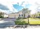 Two-story home with a three-car garage and a landscaped yard at 1511 Alligator St, St Cloud, FL 34771