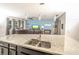 Spacious kitchen with granite countertops, stainless steel appliances, and dark wood cabinets at 1511 Alligator St, St Cloud, FL 34771