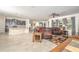 Open living room with leather sectional sofa and view of kitchen at 1511 Alligator St, St Cloud, FL 34771
