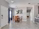 Dining room with a round table and four chairs, near kitchen at 3825 Quaint Ln # F, Clermont, FL 34711