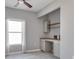 Home office with built-in desk and shelving, providing a dedicated workspace at 3825 Quaint Ln # F, Clermont, FL 34711