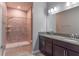 Clean bathroom with double vanity, granite countertop and a large walk-in shower at 3825 Quaint Ln # F, Clermont, FL 34711