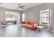 Spacious living room with coral couch and tile floors at 3825 Quaint Ln # F, Clermont, FL 34711