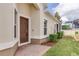 Brick walkway leading to a brown front door with sidelights at 3825 Quaint Ln # F, Clermont, FL 34711