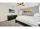 Comfortable main bedroom with a king bed and a large TV at 650 Pebble Beach Dr, Davenport, FL 33896