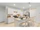 Bright kitchen featuring white cabinets and stainless steel appliances at 4656 Ostero St, Winter Haven, FL 33884