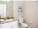 Clean bathroom with granite countertop and white cabinets at 107 Oceans Cir, Daytona Beach Shores, FL 32118