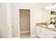 Bathroom boasts a granite vanity and a linen closet at 107 Oceans Cir, Daytona Beach Shores, FL 32118