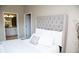 Bright bedroom with a plush bed and en-suite bathroom access at 107 Oceans Cir, Daytona Beach Shores, FL 32118