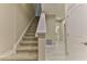 Clean and modern carpeted staircase leading to the upper level of the home at 107 Oceans Cir, Daytona Beach Shores, FL 32118