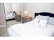 Bedroom with a mirrored closet and a blue headboard at 107 Oceans Cir, Daytona Beach Shores, FL 32118