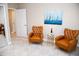 Cozy sitting area with two leather armchairs and a side table at 107 Oceans Cir, Daytona Beach Shores, FL 32118