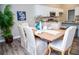 Farmhouse dining table with six chairs in a bright dining area at 107 Oceans Cir, Daytona Beach Shores, FL 32118