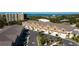 Aerial view of townhouses with gray roofs and garages at 107 Oceans Cir, Daytona Beach Shores, FL 32118