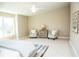 Relaxing bedroom with two armchairs and a large window at 107 Oceans Cir, Daytona Beach Shores, FL 32118