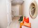 Bright and airy entryway with tiled floors, bench seating, and a large mirror at 107 Oceans Cir, Daytona Beach Shores, FL 32118